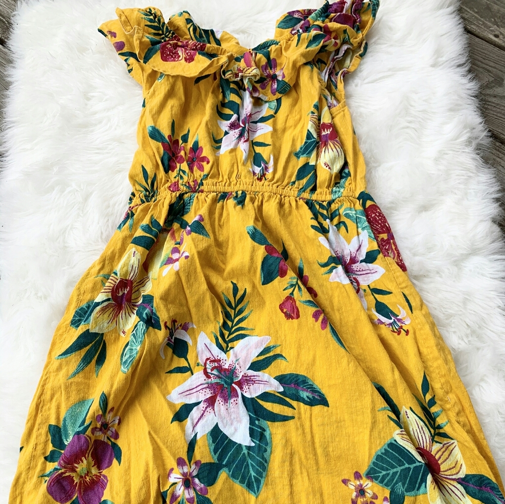 Yellow girl dress with tropical flowers